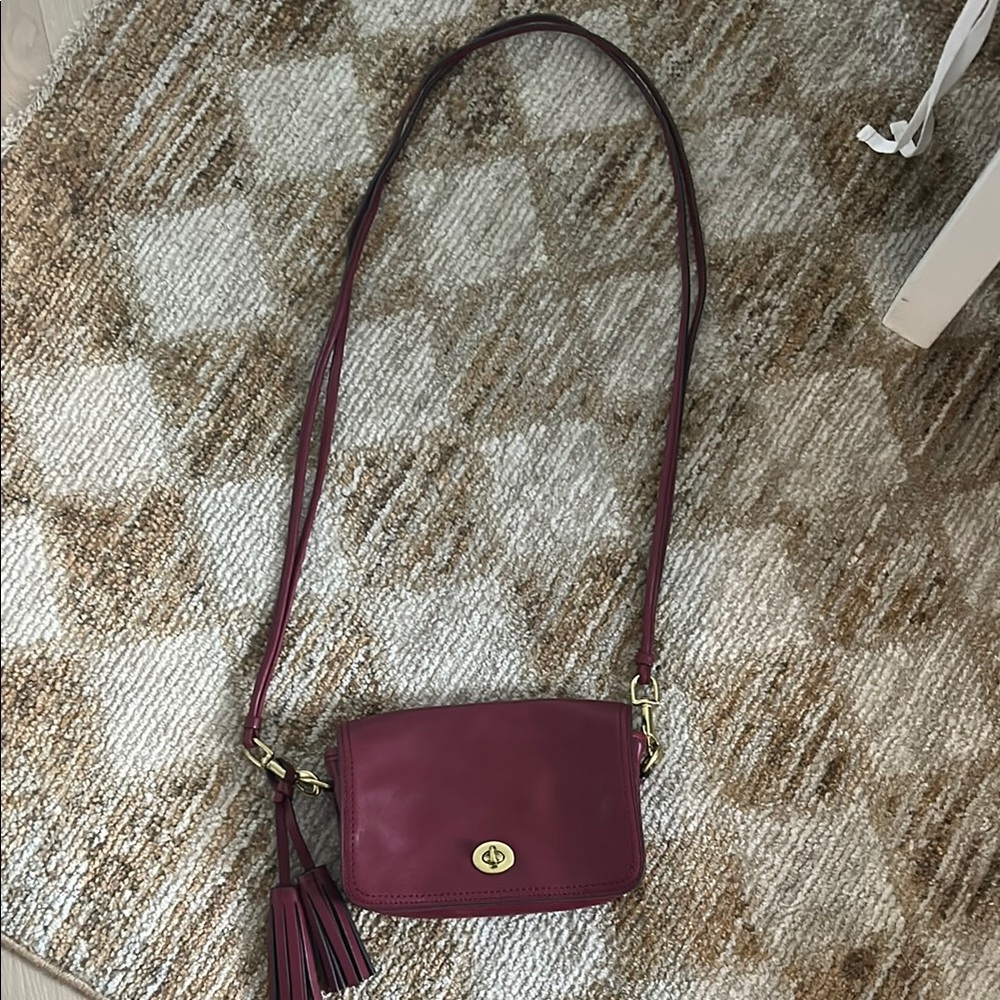 Coach Red Crossbody Bag with Gold Accents and Flap Closure